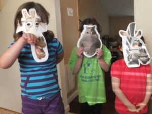 Kids Wearing their Madagascar Face Masks