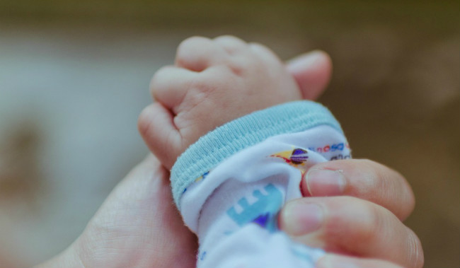 hand and baby